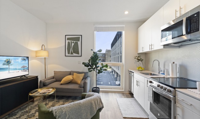 Kitchen and living space at The Clark new apartments in Philadelphia